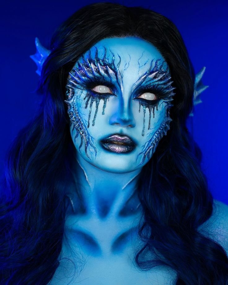Dark lip makeup paired with dark mermaid makeup style
