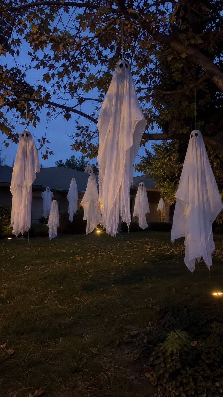 Illuminated yard stakes and dark silhouettes for spooky halloween decorations outdoor