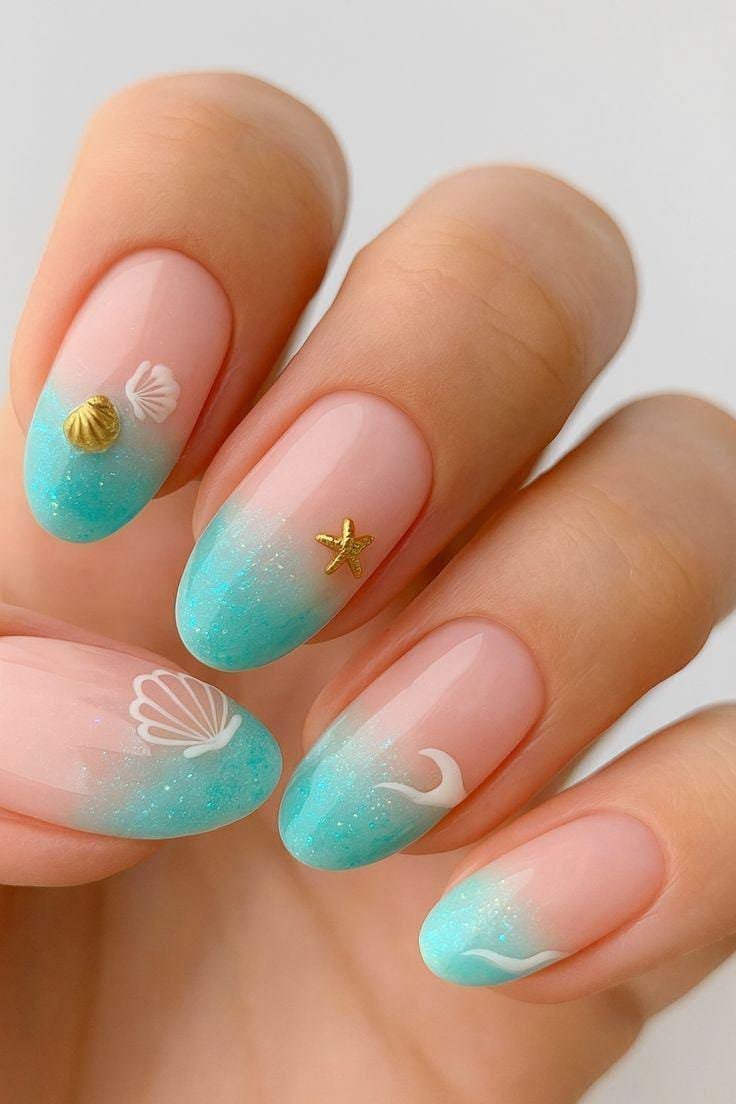 Close up of professional sea inspired nails with blue waves and foam