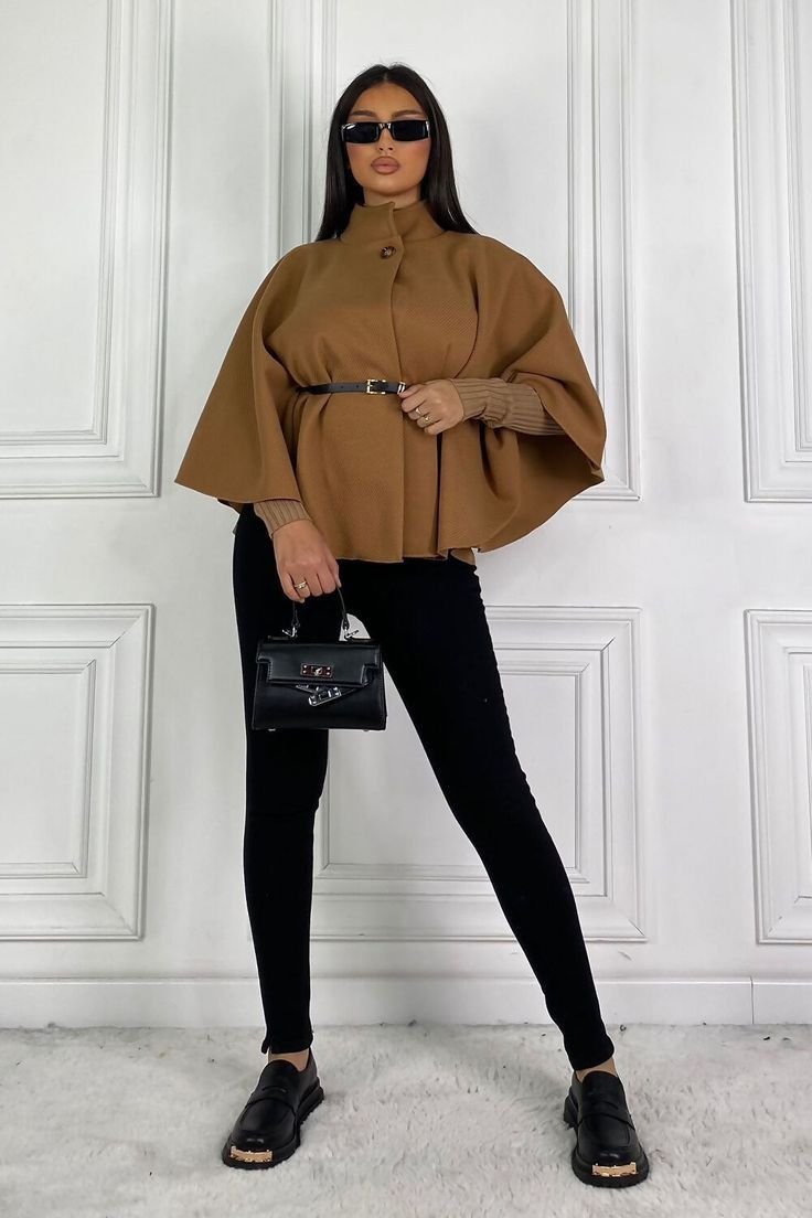 Cohesive cape outfit aesthetic combining elements for a perfectly coordinated fashion statement.
