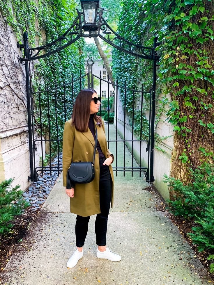 Professional attire paired with a sleek leather satchel bag for a business setting.