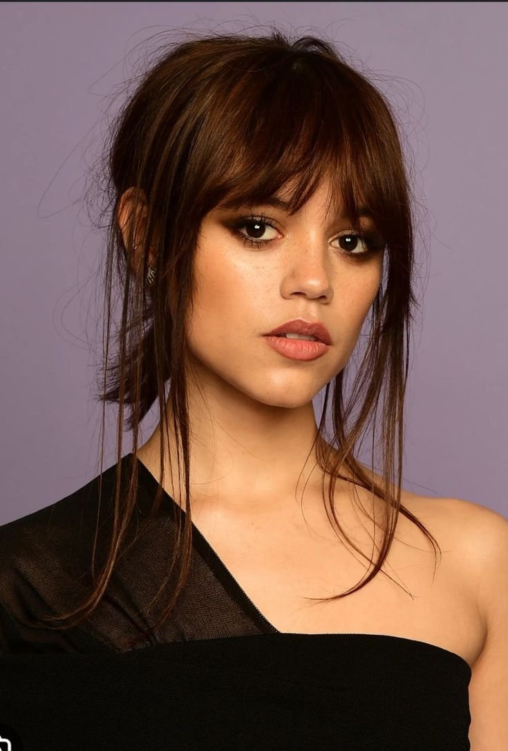 A vampire haircut with subtle, blended layers creating a softer, more understated edgy look.