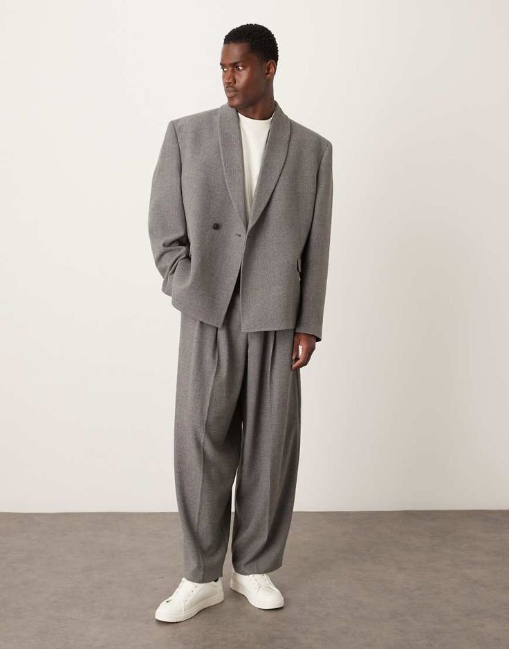 Woman in a light-colored baggy suit outfit made from breathable fabric for warm climates