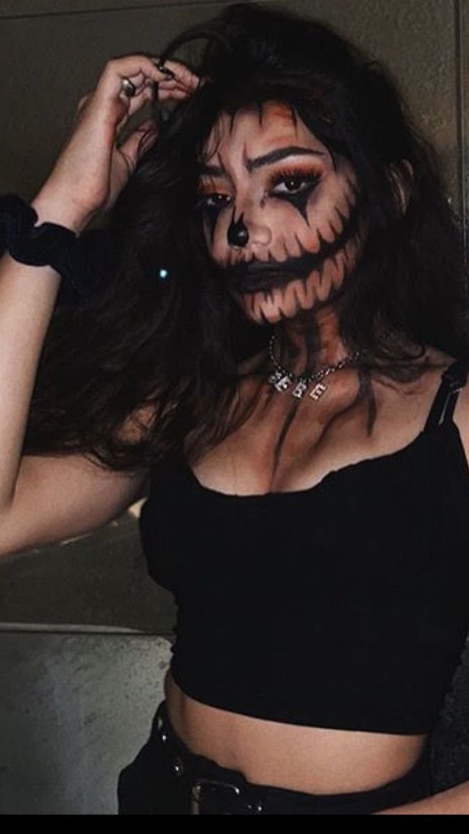 Glamorous red demon makeup with sculpted horns and smoky eyes