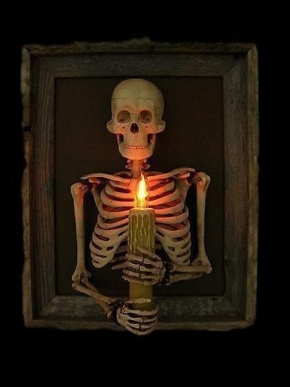 Giant poseable skeleton dominating the lawn as a centerpiece for halloween yard ideas