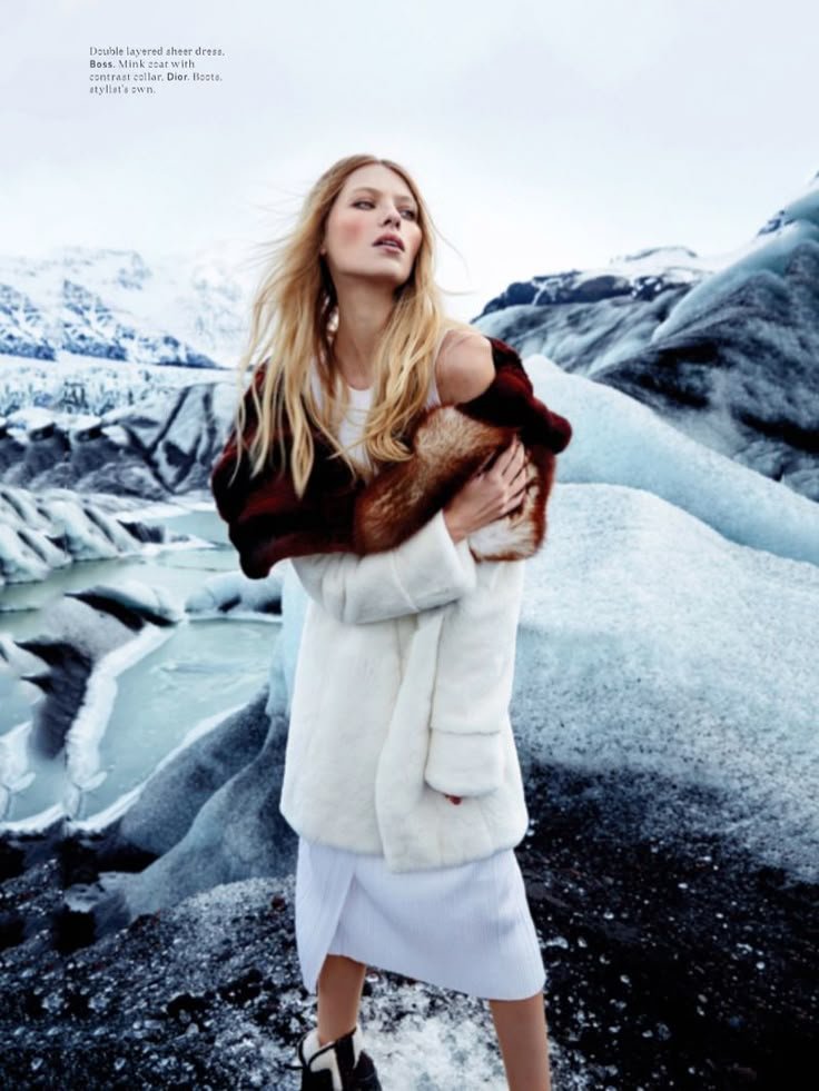 Stylish woman in a cool-toned outfit in a minimalistic setting, inspiring icy fashion looks.
