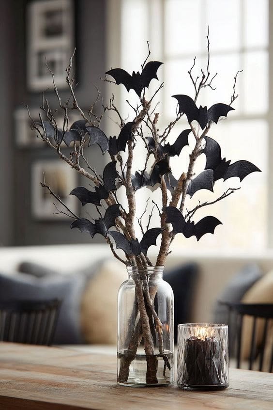Pre-lit eerie black twig trees framing an entryway to elevate outdoor halloween decor