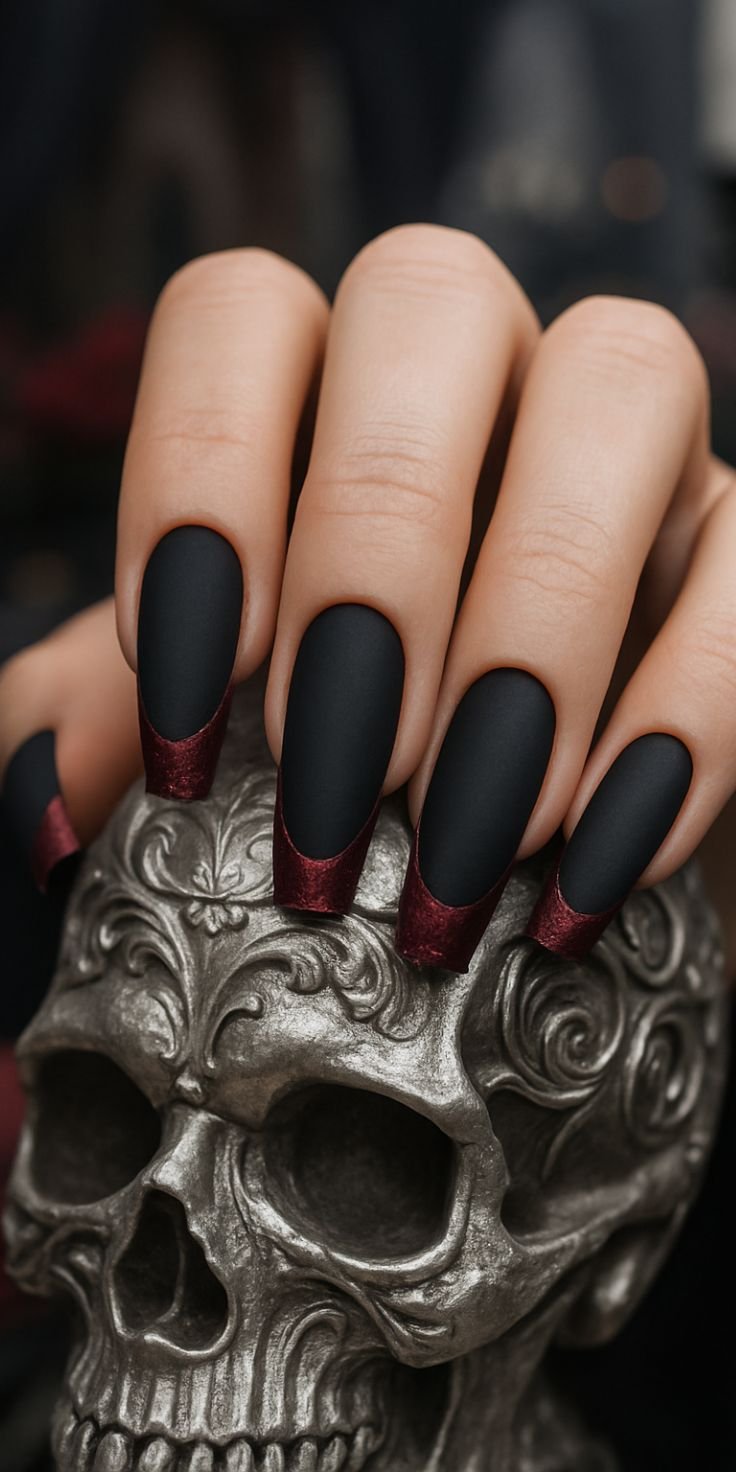 Elegant long acrylic gothic coffin nails with a gradient of black to deep red, featuring subtle glitter.