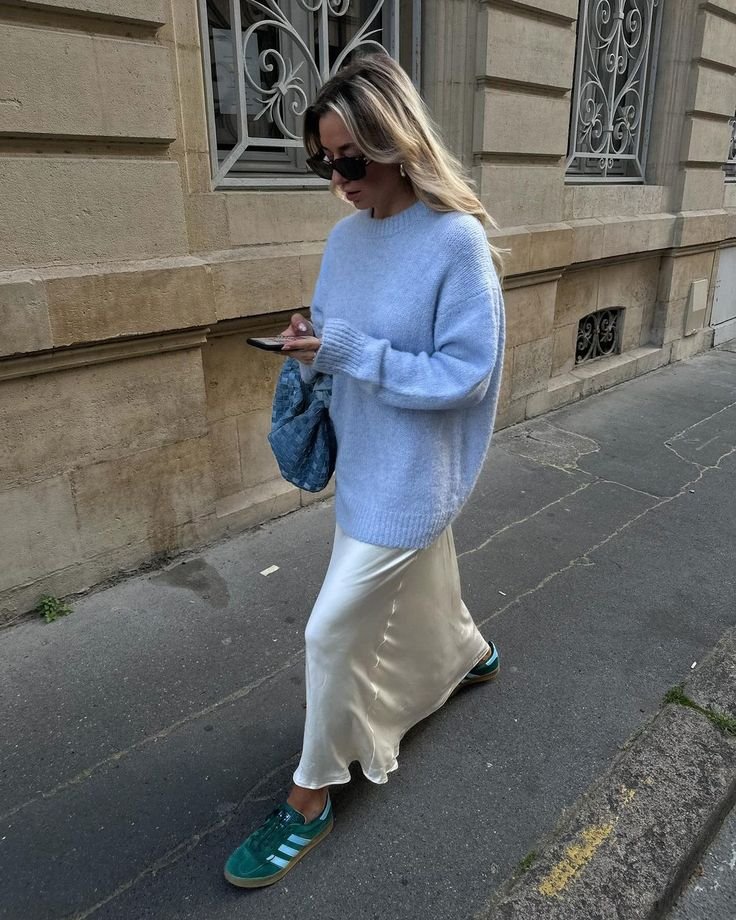 An outfit featuring an icy blue top paired with dark navy trousers, showing a sophisticated contrast for depth.