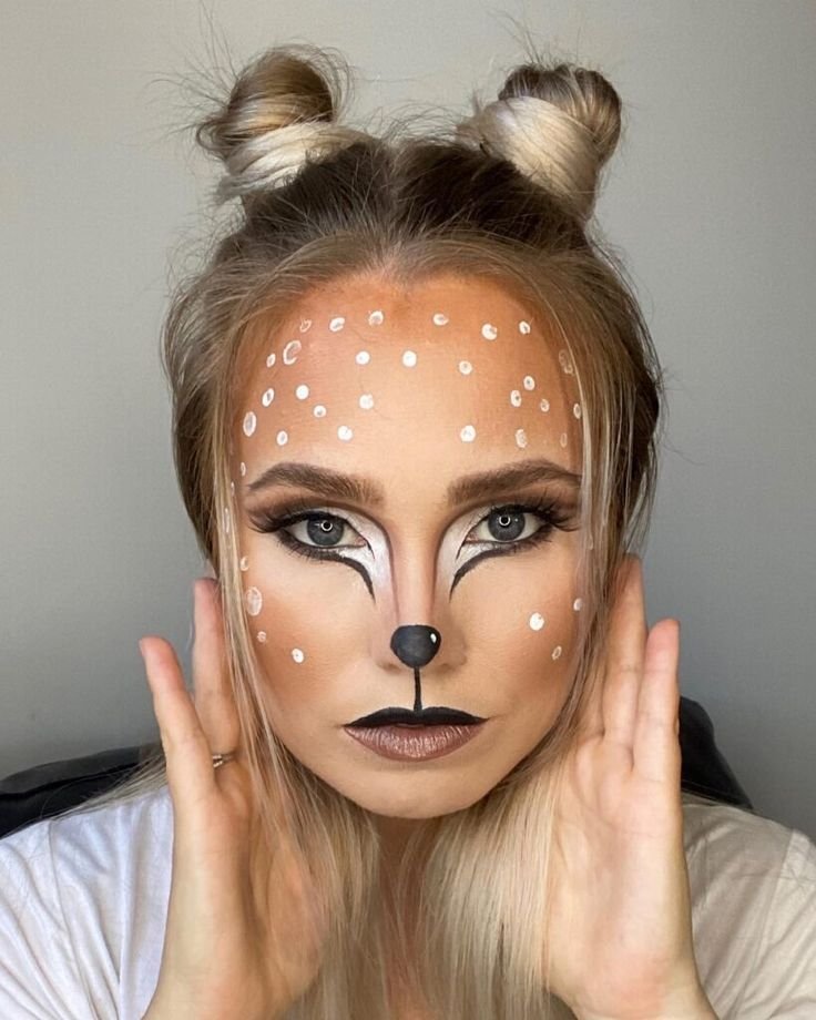 Deer makeup glittering accents highlighting the eyes and cheeks for a magical festive appearance