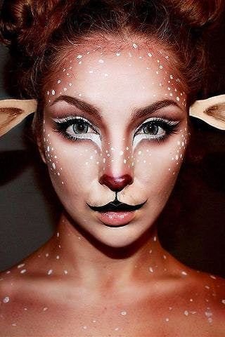 Close up of professional deer makeup application showcasing precise contouring and white dot details