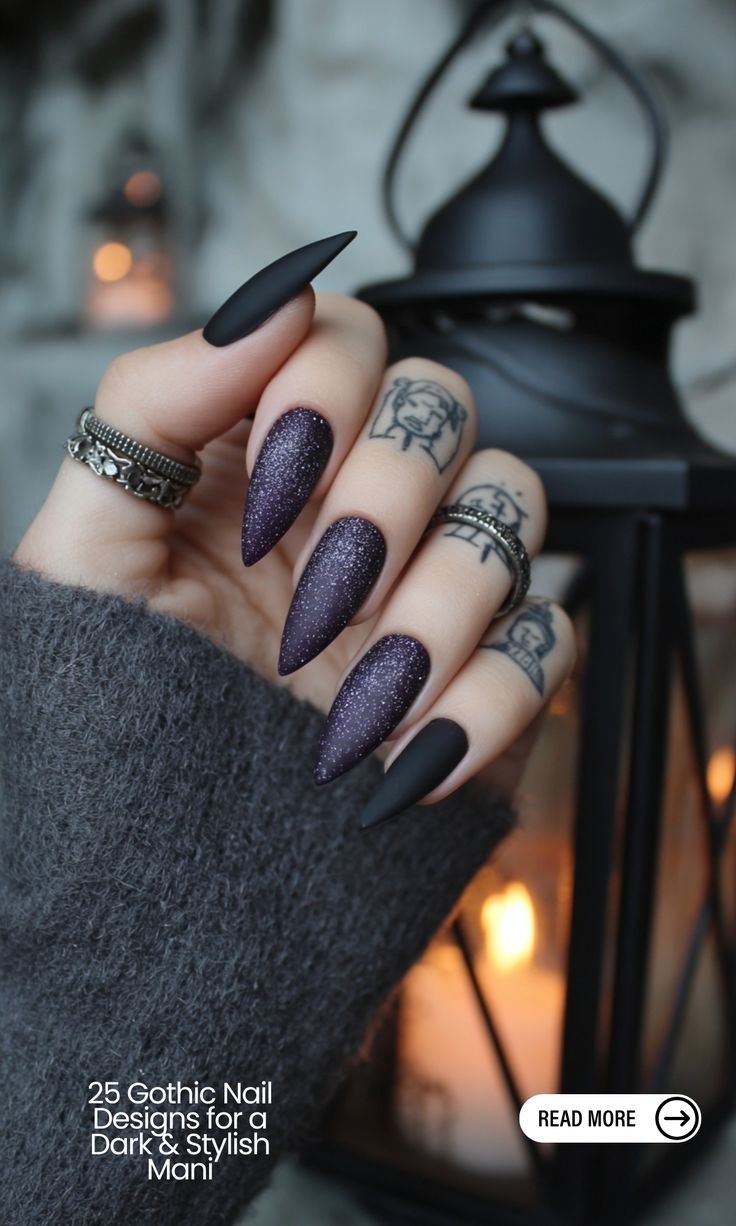 Dark blue gothic coffin nails with a shimmering finish and subtle crystal accents near the cuticle.