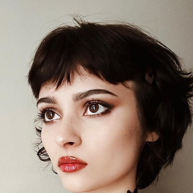 Historical illustrations showing Victorian-era hairstyles and gothic fashion influencing the vampire haircut.