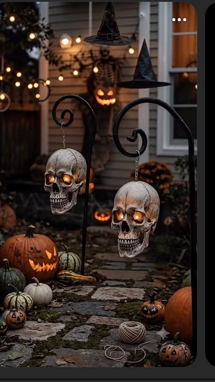 Dark silhouette cutouts of witches casting spooky shadows for minimalist halloween yard ideas