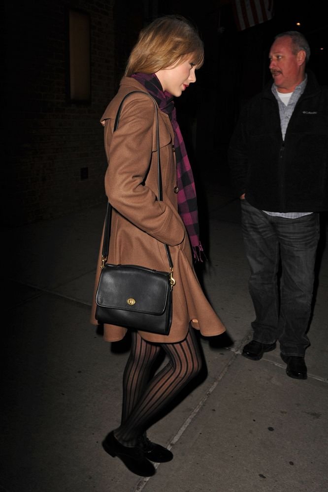 Business casual ensemble with a structured satchel bag, suitable for office settings.