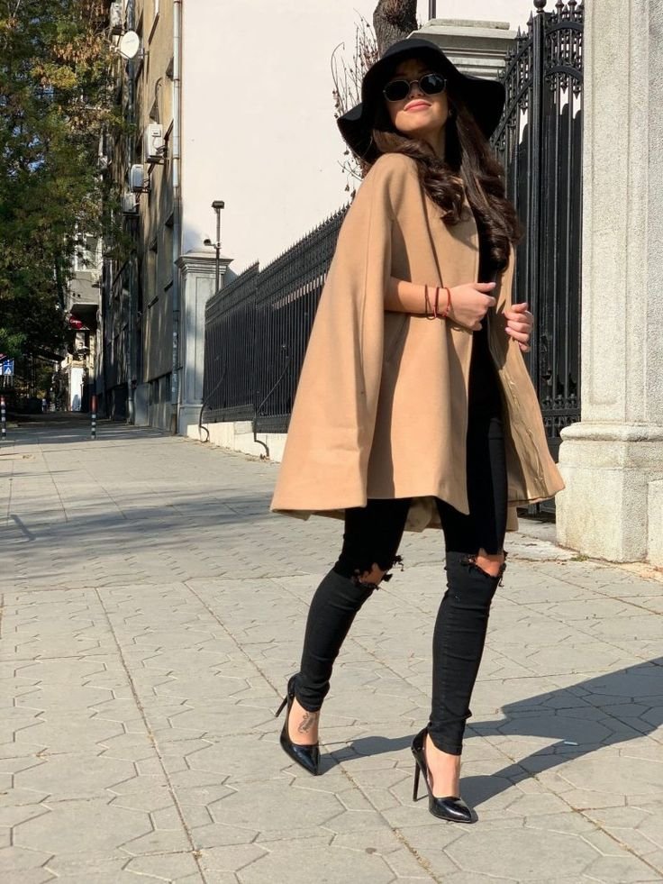 Professional cape outfit for the workplace, paired with a sophisticated business dress.